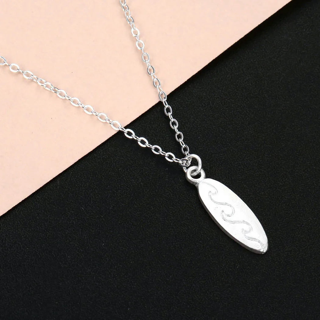 Blue Flow | Ocean Wave Surfboard Necklace š